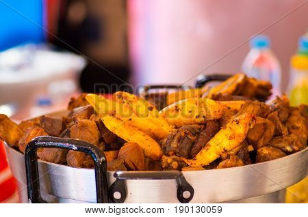 Close up of hornado roasted pork with some plantains ecuadorian traditional typical andean food.