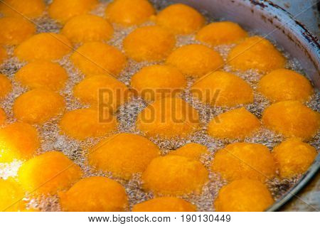 Homemade fritters with sugar and its ingredients latin food, called huevos chilenos.