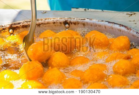 Homemade fritters with sugar and its ingredients latin food, called huevos chilenos.