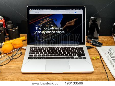 PARIS FRANCE - JUNE 6 2017: Apple Computers website on MacBook Retina in creative environment showcasing latest news from Apple at WWDC 2017 - The most advanced display on the planet about retina