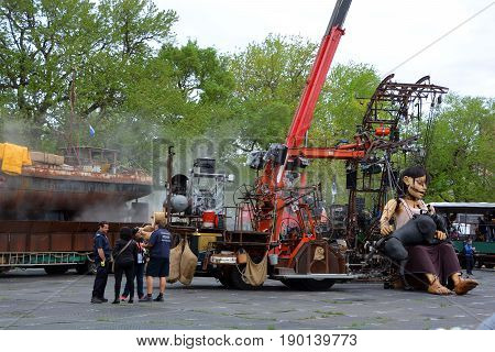 MONTREAL QUEBEC CANADA 19 05 17: The little giant girl walking in the street of Montreal for the 375e anniversary of the city, by Royal De Luxe company Nantes France