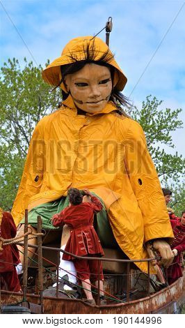 MONTREAL QUEBEC CANADA 19 05 17: The little giant girl walking in the street of Montreal for the 375e anniversary of the city, by Royal De Luxe company Nantes France