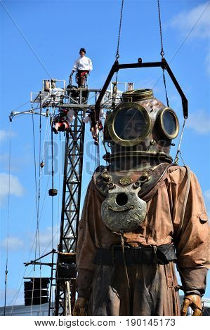 MONTREAL QUEBEC CANADA 19 05 17: The giant deep-sea diver sleeping in the street of Montreal for the 375e anniversary of the city, by Royal De Luxe company Nantes France
