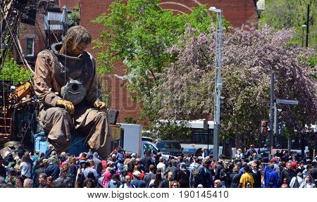 MONTREAL QUEBEC CANADA 19 05 17: The giant deep-sea diver sleeping in the street of Montreal for the 375e anniversary of the city, by Royal De Luxe company Nantes France