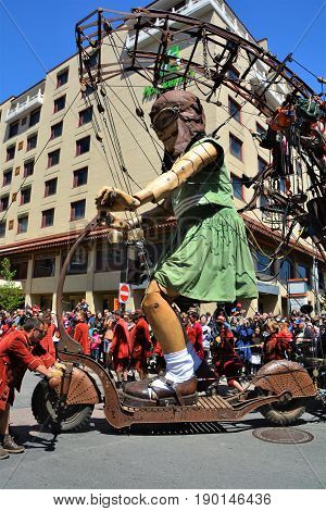 MONTREAL QUEBEC CANADA 19 05 17: The little giant girl walking in the street of Montreal for the 375e anniversary of the city, by Royal De Luxe company Nantes France