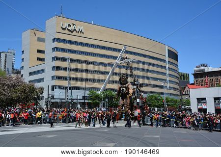 MONTREAL QUEBEC CANADA 19 05 17: The giant deep-sea diver sleeping in the street of Montreal for the 375e anniversary of the city, by Royal De Luxe company Nantes France