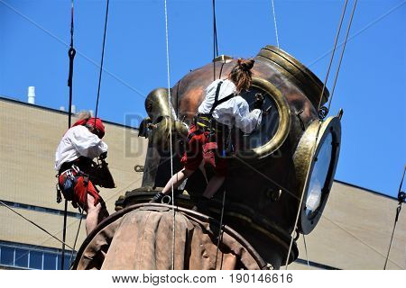 MONTREAL QUEBEC CANADA 19 05 17: The giant deep-sea diver sleeping in the street of Montreal for the 375e anniversary of the city, by Royal De Luxe company Nantes France