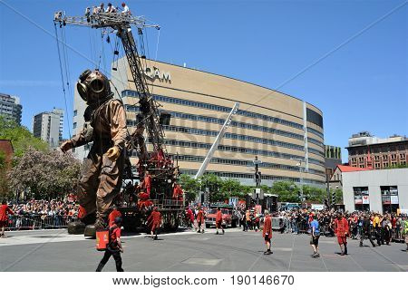 MONTREAL QUEBEC CANADA 19 05 17: The giant deep-sea diver sleeping in the street of Montreal for the 375e anniversary of the city, by Royal De Luxe company Nantes France