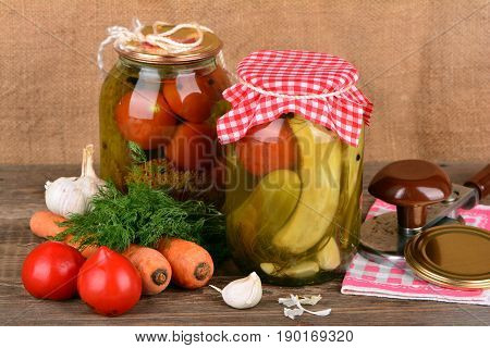 Home canning, canned vegetables on wooden table