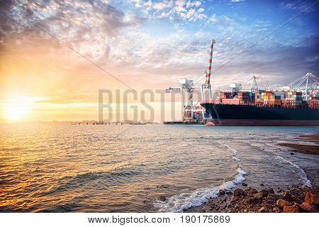 Logistics import export background of Container Cargo ship in the ocean st sunset sky Freight Transportation