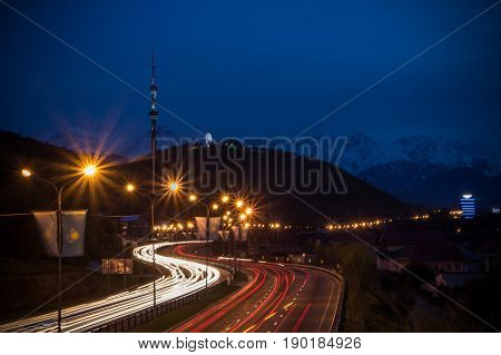 Almaty City Night View, Kok Tobe Hill. Lights Trails At Night On The Road