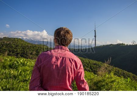 Young Man In Pink Shirt From Back Enjoying Beautiful Mountain View, Almaty, Kok Tobe