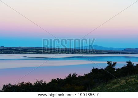 Beautiful sweet colour Pukaki lake in twilight at dusk Mackenzie District Canterbury South Island of New Zealand