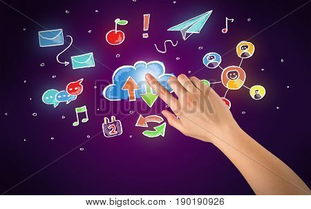 Female hand toucing mixed media icons with purple background
