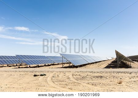 solar panels on the gobi against abundant sunshine sky new energy background
