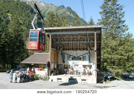 People Waiting In Line To Get On The Cable Car