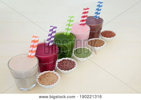 High protein and health supplement super food drinks of maca root herb, acai berry, wheat grass, pomegranate fruit and chocolate whey. Also used by body builders.
