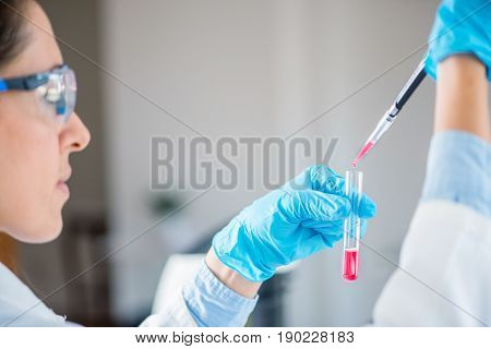 Laboratory Technician With Micro Pipette, Toned Image, Indoors, One Person Only