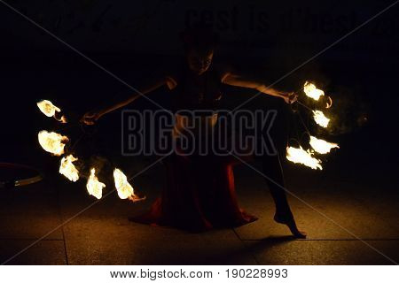 ZAGREB - MAY 2017 : Cest is d'Best famous street festival with many performers on May 2017 in Zagreb. Yanika fire performer doing her dance with fire