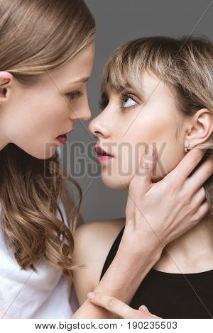 Portrait Of Young Sensual Lesbian Couple Emracing And Looking On Eath Other