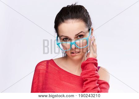 Woman in blue glasses on isolated background, portrait.