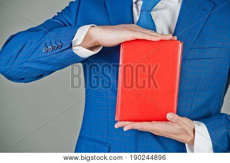 Notebook In Hand Of Man, Businessman In Blue Outfit