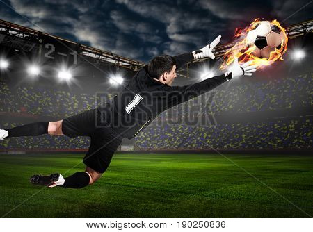 Soccer or football goalkeeper catching ball on stadium