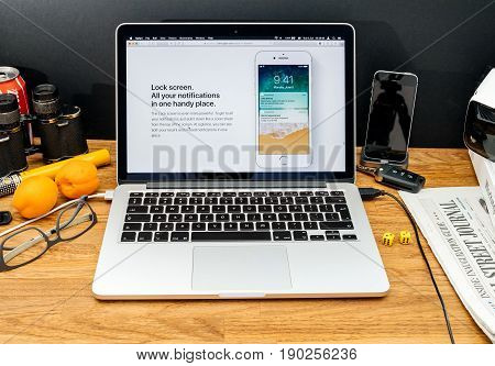 PARIS FRANCE - JUNE 6 2017: Apple Computers website on MacBook Retina in creative environment showcasing latest news from Apple at WWDC 2017 - new lock screen in ios 11