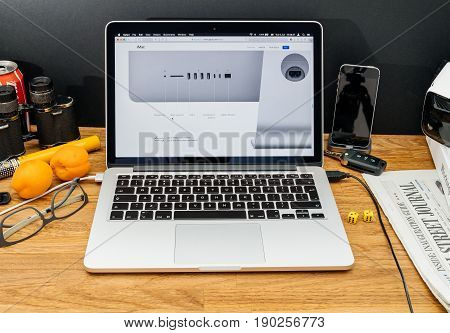 PARIS FRANCE - JUNE 6 2017: Apple Computers website on MacBook Retina in creative environment showcasing latest news from Apple at WWDC 2017 - thunderbolt 3 and all ports on rear of imac