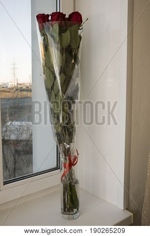 Red roses as symbol of love and passion in the bouquet