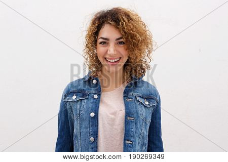 Confident Young Woman With Curly Hair Smiling Abasing White Background