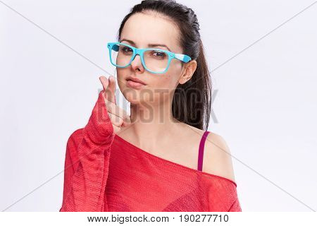 Woman in glasses, the girl is posing with glasses. Woman background glasses.