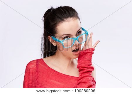 Woman in glasses, the girl is posing with glasses. Woman background glasses.
