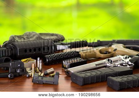 Bullets and a firearm. Bullets are a projectile expelled from the barrel of a firearm, on wooden table.