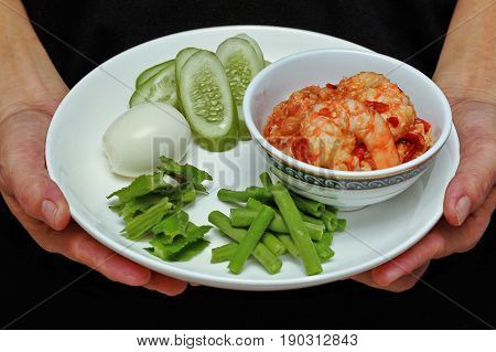 Thai Popular cuisine Fresh shrimp chili dip as Nam Prik Kung Sod in Thai and boiled egggreen bean winged bean and cucumber.