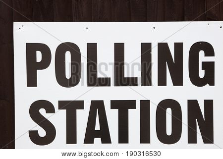LONDON, UNITED KINGDOM - JUNE 8, 2017: A polling station sign is hanged outside during the British general elections in South London, United Kingdom on June 8, 2017.
