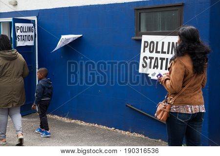 LONDON, UNITED KINGDOM - JUNE 8, 2017: Unidentified citizens going to vote at a polling station during the British general elections in South London, United Kingdom on June 8, 2017.