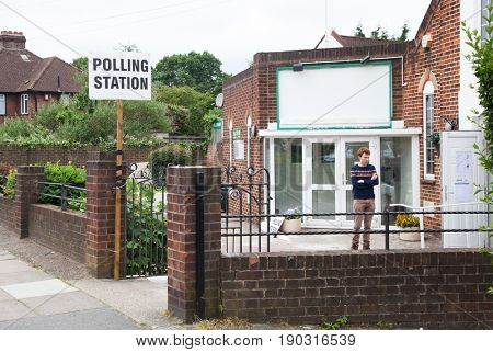 LONDON, UNITED KINGDOM - JUNE 8, 2017: Unidentified citizens going to vote at a polling station during the British general elections in South London, United Kingdom on June 8, 2017.