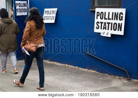LONDON, UNITED KINGDOM - JUNE 8, 2017: Unidentified citizens going to vote at a polling station during the British general elections in South London, United Kingdom on June 8, 2017.