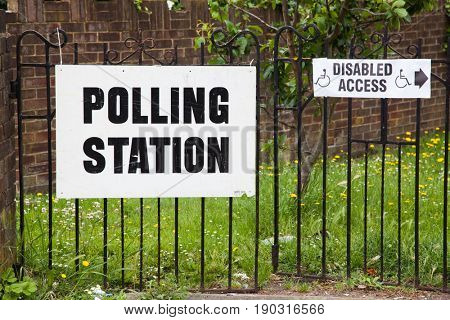 LONDON, UNITED KINGDOM - JUNE 8, 2017: A polling station sign is hanged outside during the British general elections in South London, United Kingdom on June 8, 2017.