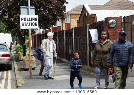 LONDON, UNITED KINGDOM - JUNE 8, 2017: Unidentified citizens going to vote at a polling station during the British general elections in South London, United Kingdom on June 8, 2017.