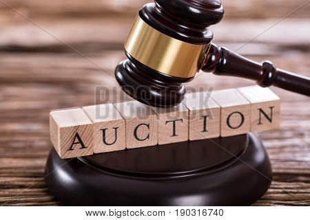 Close-up Of A Gavel Striking On Auction Word