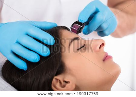 Woman Having Facial Treatment On Her Face In Beauty Salon