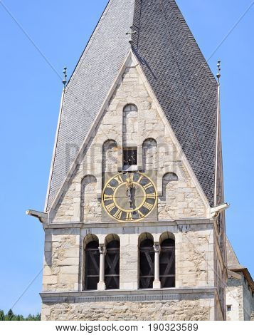 Clock on a tower of Catholic church