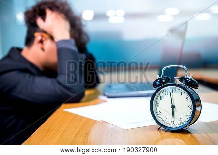 busy and headache person unsuccessful businessman on deadline