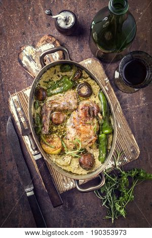 Rabbit with Vegetable and Mushrooms in White Wine Cream Sauce as top view in a Stewpot 