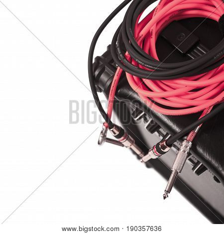 Close-up of guitar amplifier with jack cable.