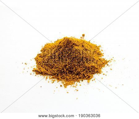 Powder curry isolated on white background. Close-up.
