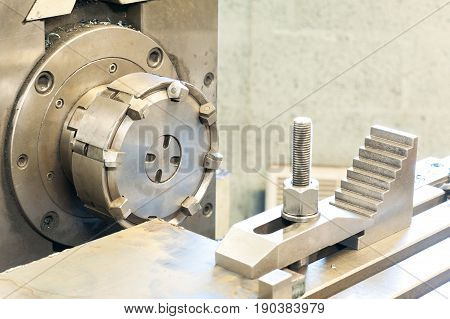 End milling with horizontal side mill machine. Metalworking mechanical engineering lathe and milling technology. Indoors horizontal image.