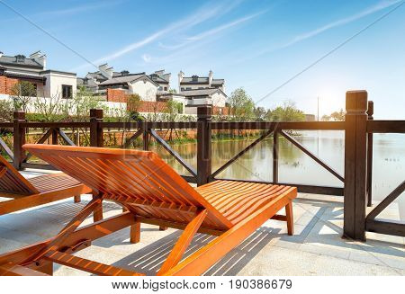 Leisure chairs and lake Huizhou ancient buildings